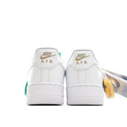 White Air Force 1 sneaker back view with Nike Air heel branding and green accents