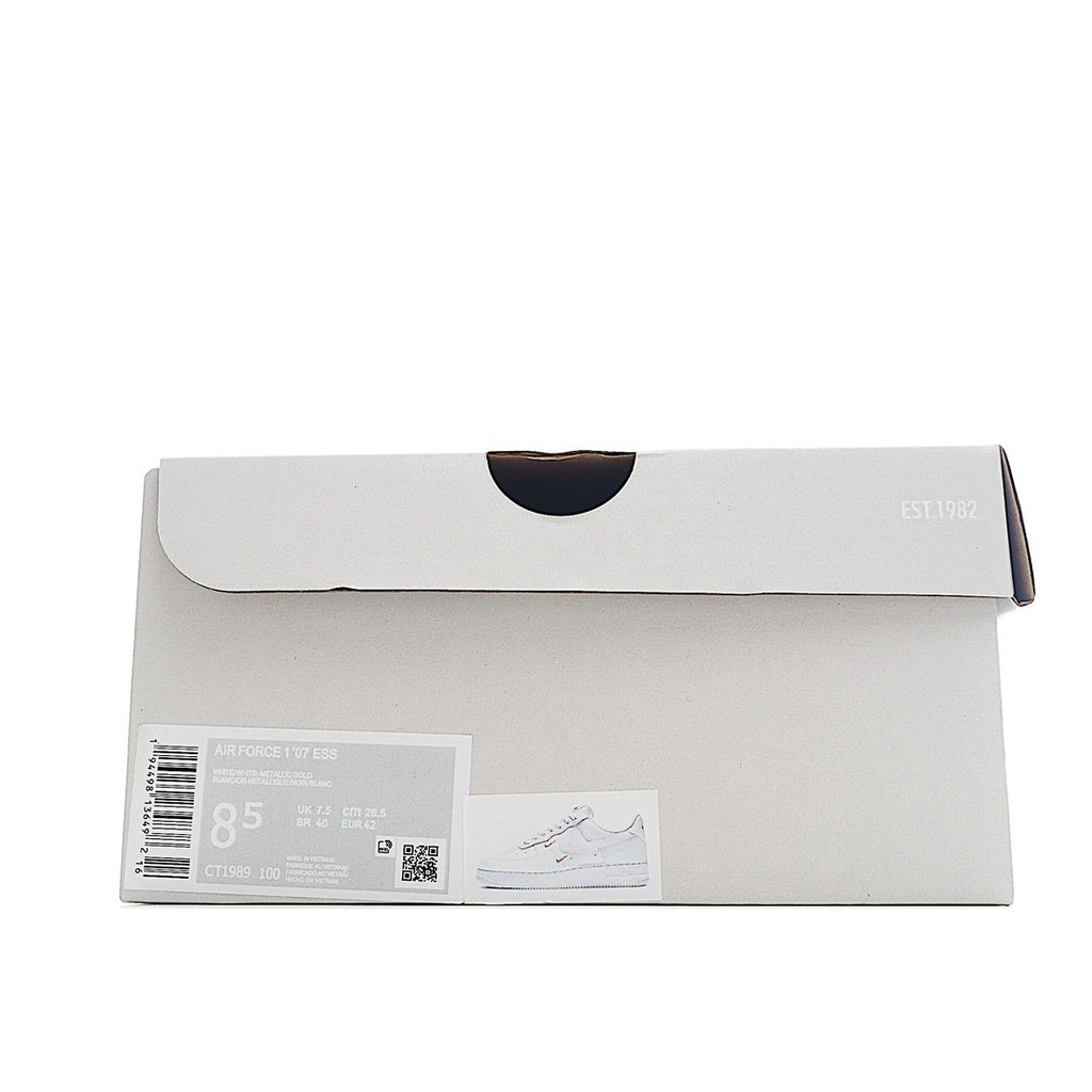 Shoe box with white lid and label, marked 1982 and size sticker
