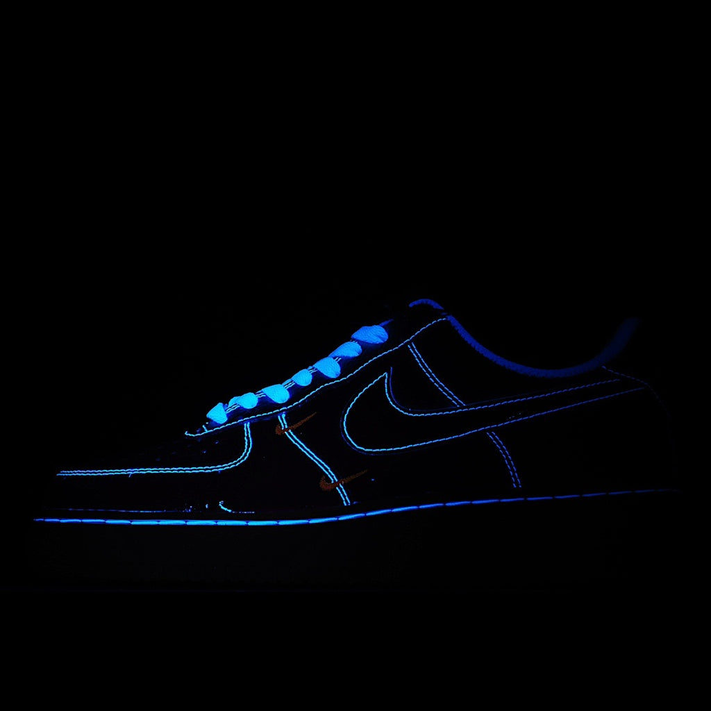 Dark sneakerscape of Air Force 1 silhouette with blue neon outline and laces