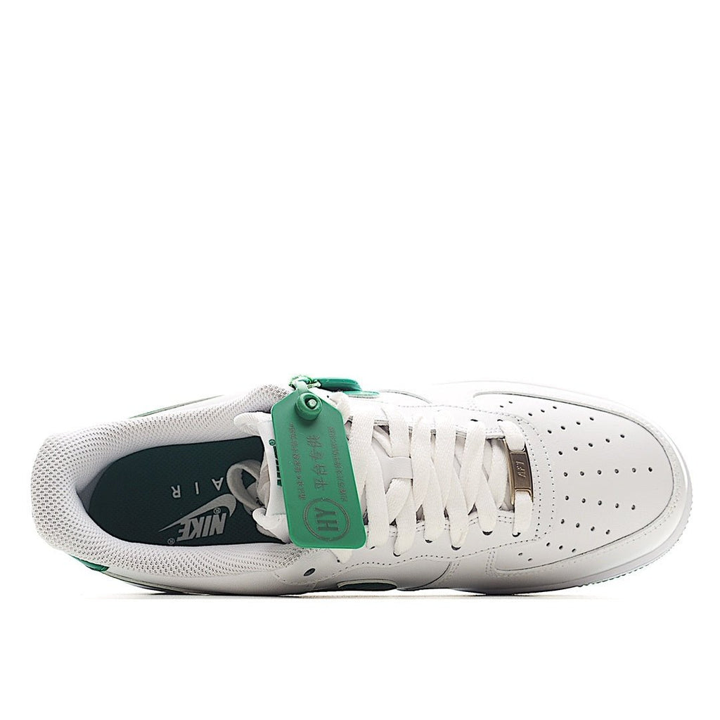 Nike Air Force 1 low-top sneakers, heel and inner side view; white with green accents