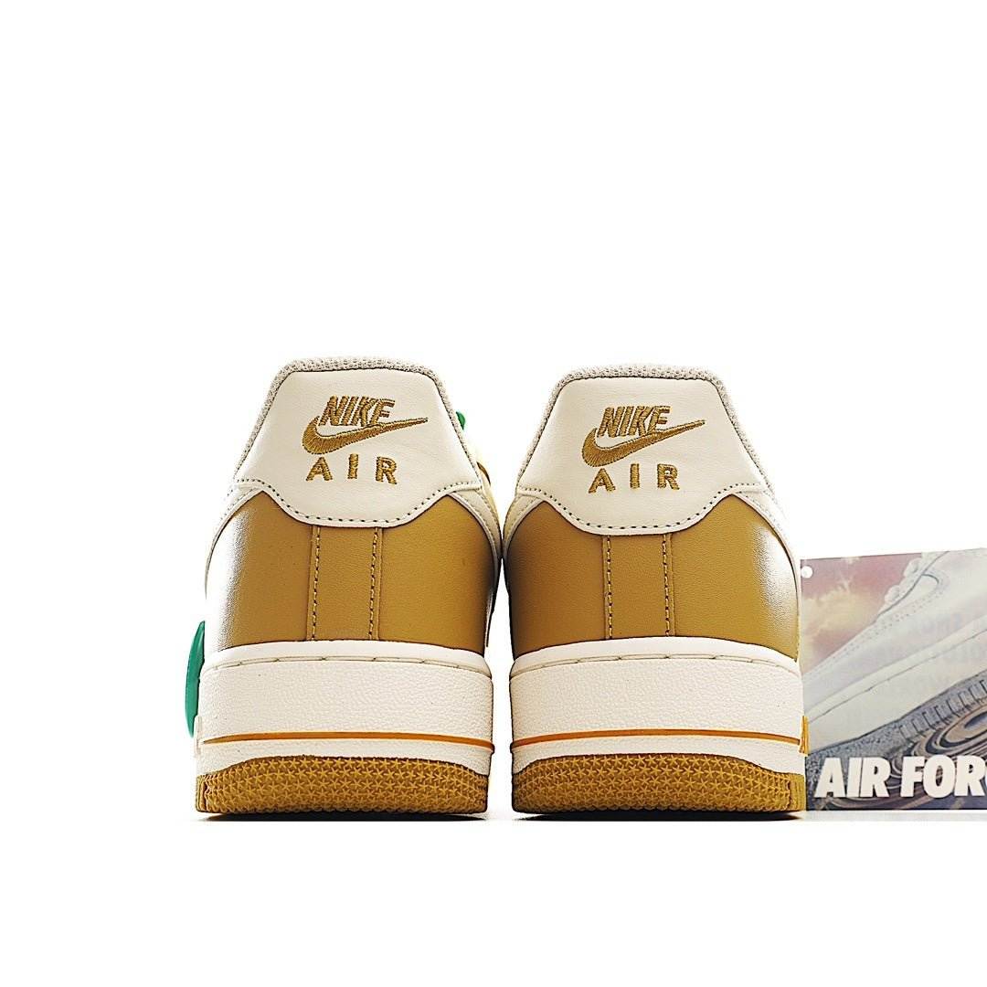 Nike Air Force 1 sneakers, back view, white and tan leather with green heel accents