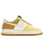 Air Force 1 low-top sneakers profile, yellow and white leather with green heel tag