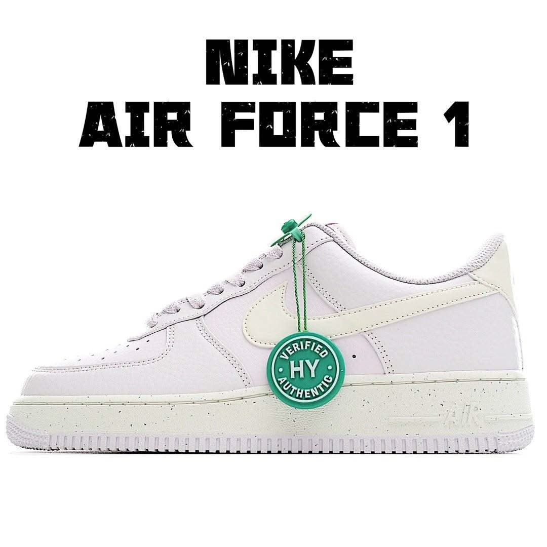 Nike Air Force 1 low sneakers in white with light green accents and green lace