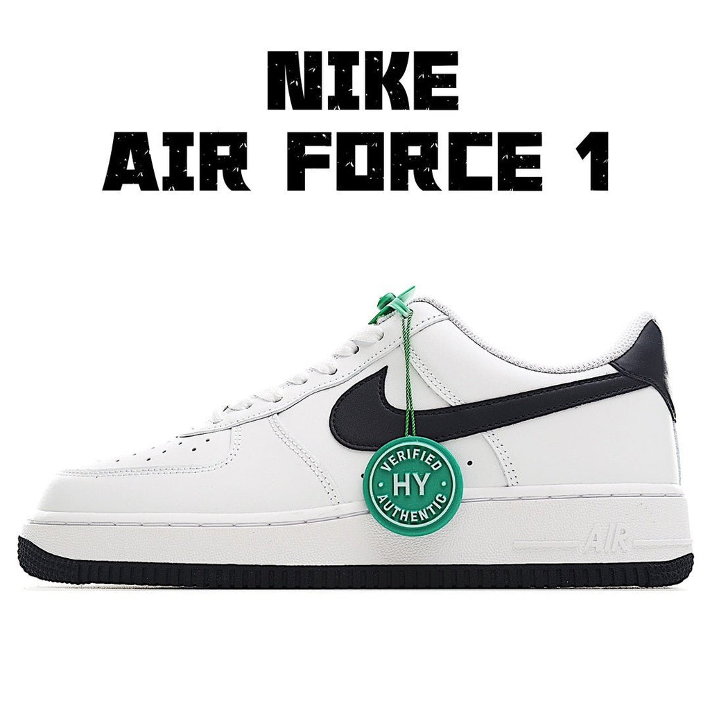White low-top sneaker with black swoosh and green lace details, side view