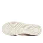 Low-top sneaker outsole, off-white rubber tread with circular traction grooves