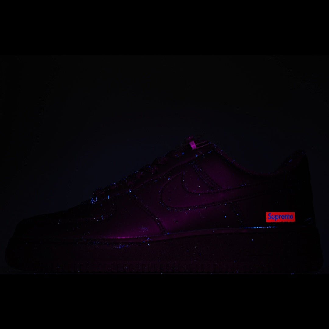 Nike Air Force 1 Low sneaker with purple and red glow accents