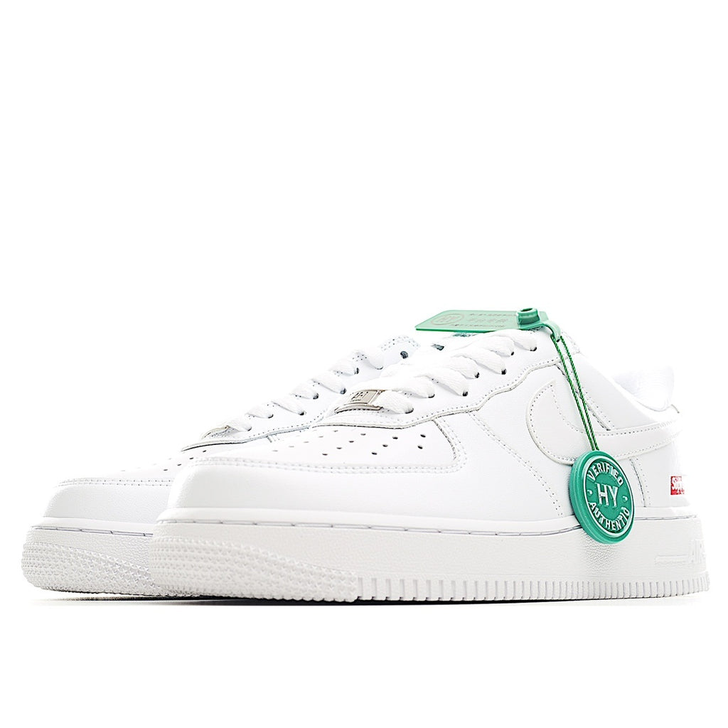 White low-top sneaker side view with green laces and “HY Verified Authentic” tag