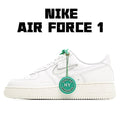 White Nike Air Force 1 low sneakers with green lace tag and swoosh logo