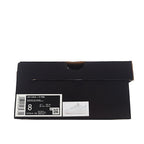 Black Nike sneaker box with barcode label and included shoe photo