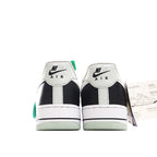Nike Air Force 1-style sneakers, black and white heels with green heel accent.