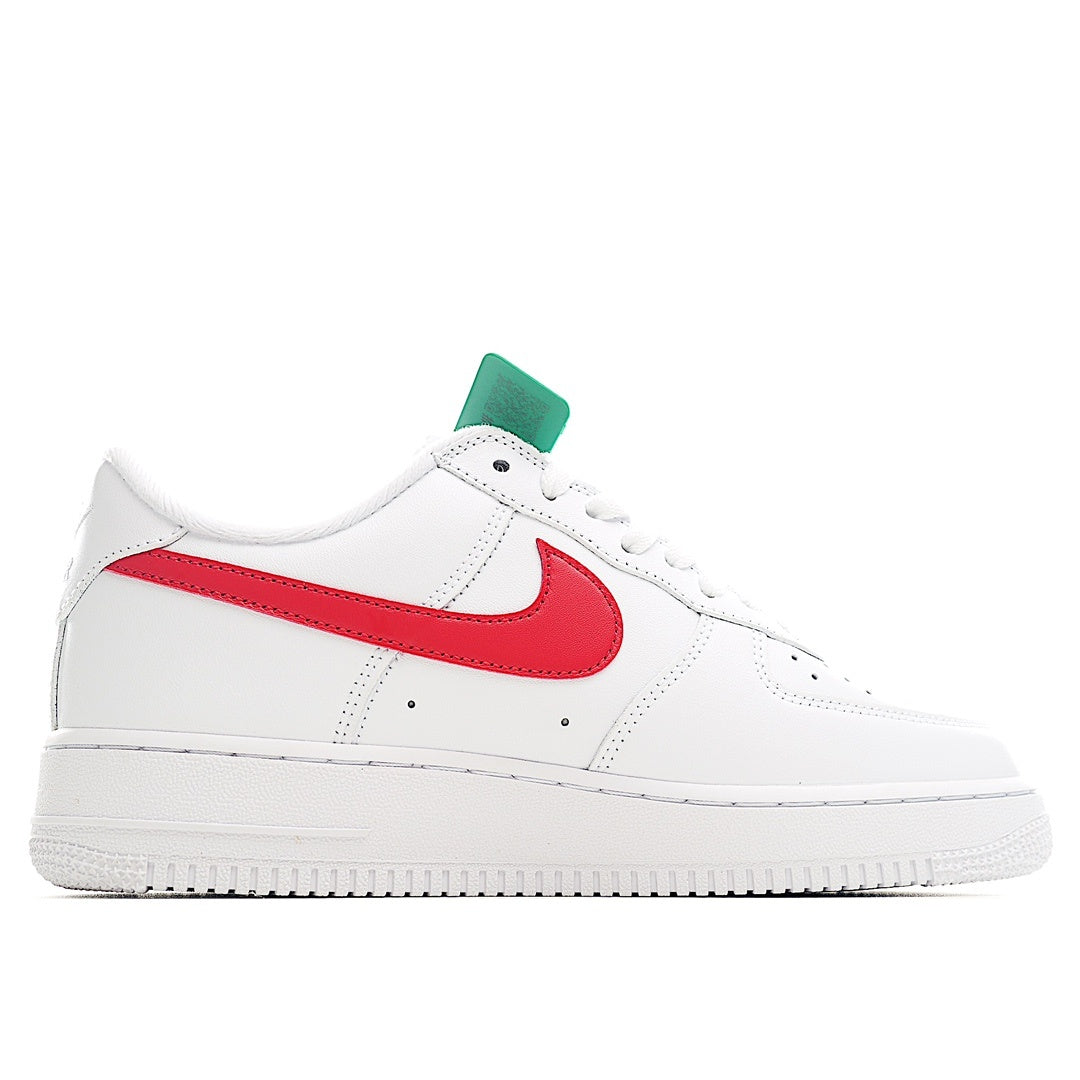 White low-top sneakers with red swoosh and green lace tag, front side view