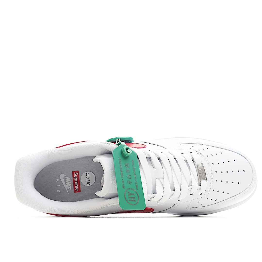 White sneakers with red accents and green hang tag in heel area, side view