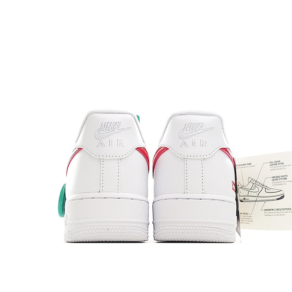 White sneakers with red and green heel accents, back view