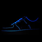 Blue low-top sneakers with neon-blue laces and glowing stripe accents