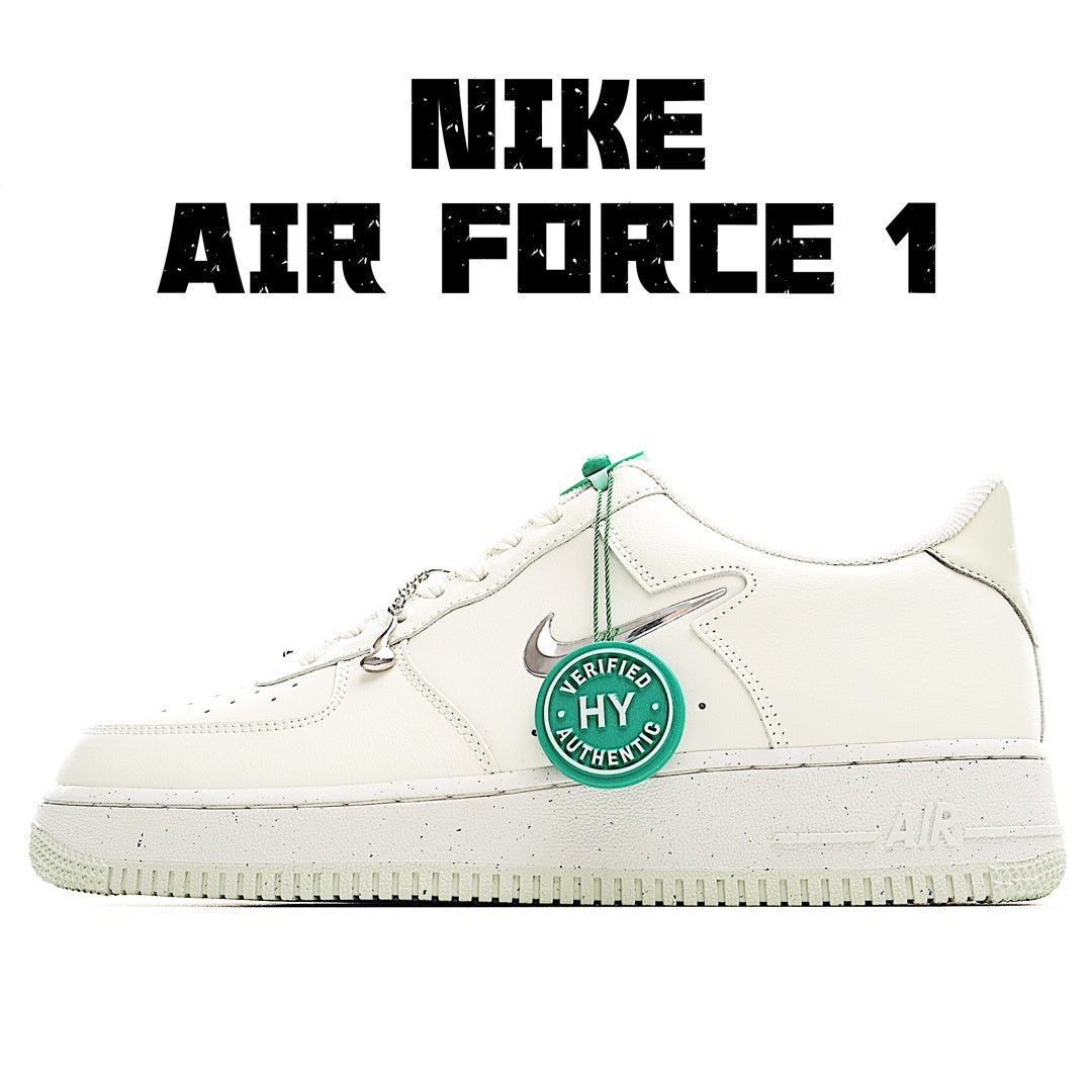 White Nike Air Force 1 sneakers with green lace tips and HY authentication badge