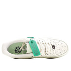 White Nike sneaker showing green interior lining and HY tag