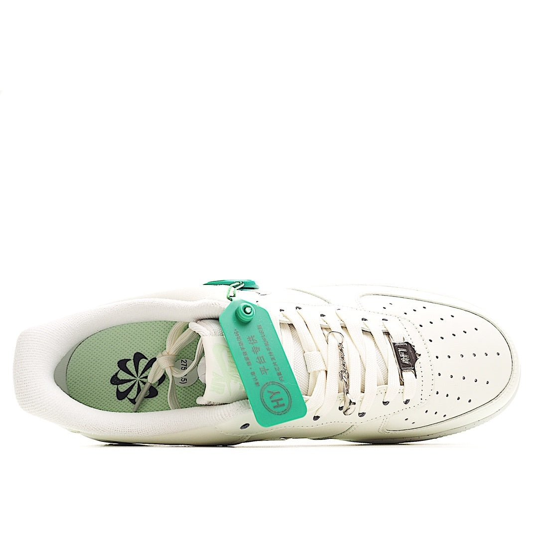 White Nike sneaker showing green interior lining and HY tag