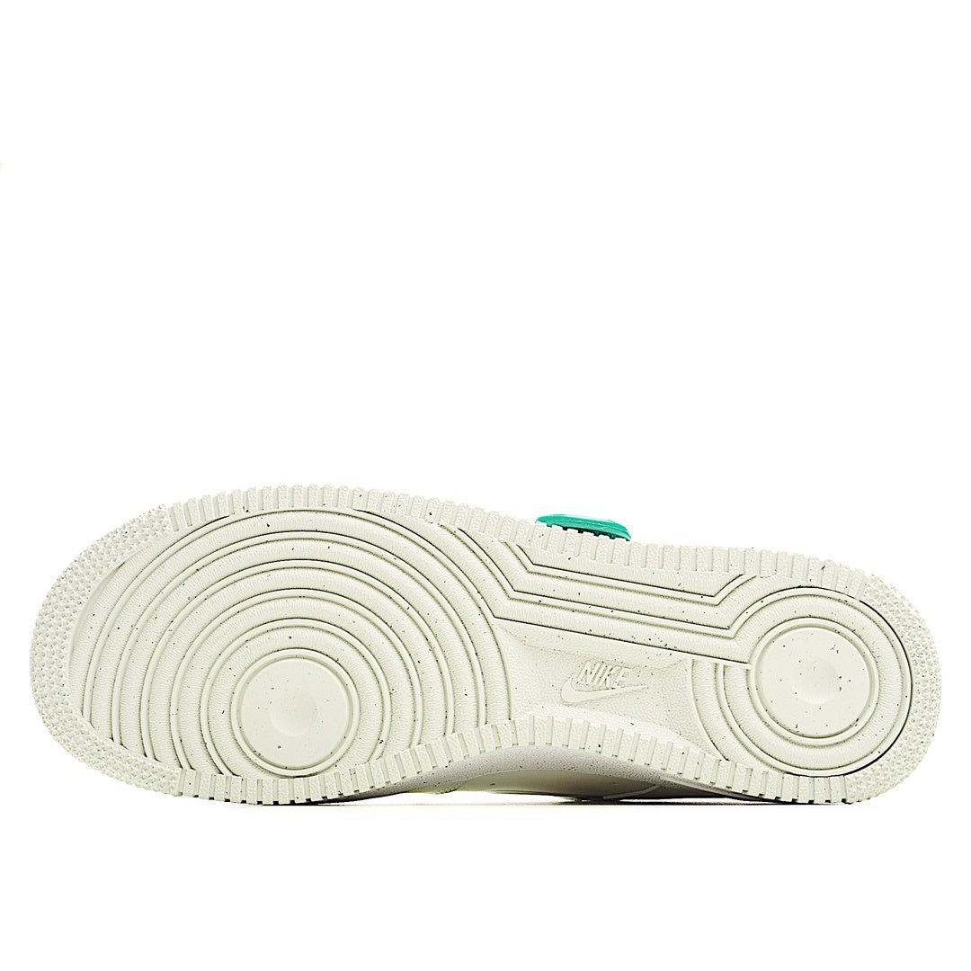 White Nike outsole with textured tread and circular rubber pattern