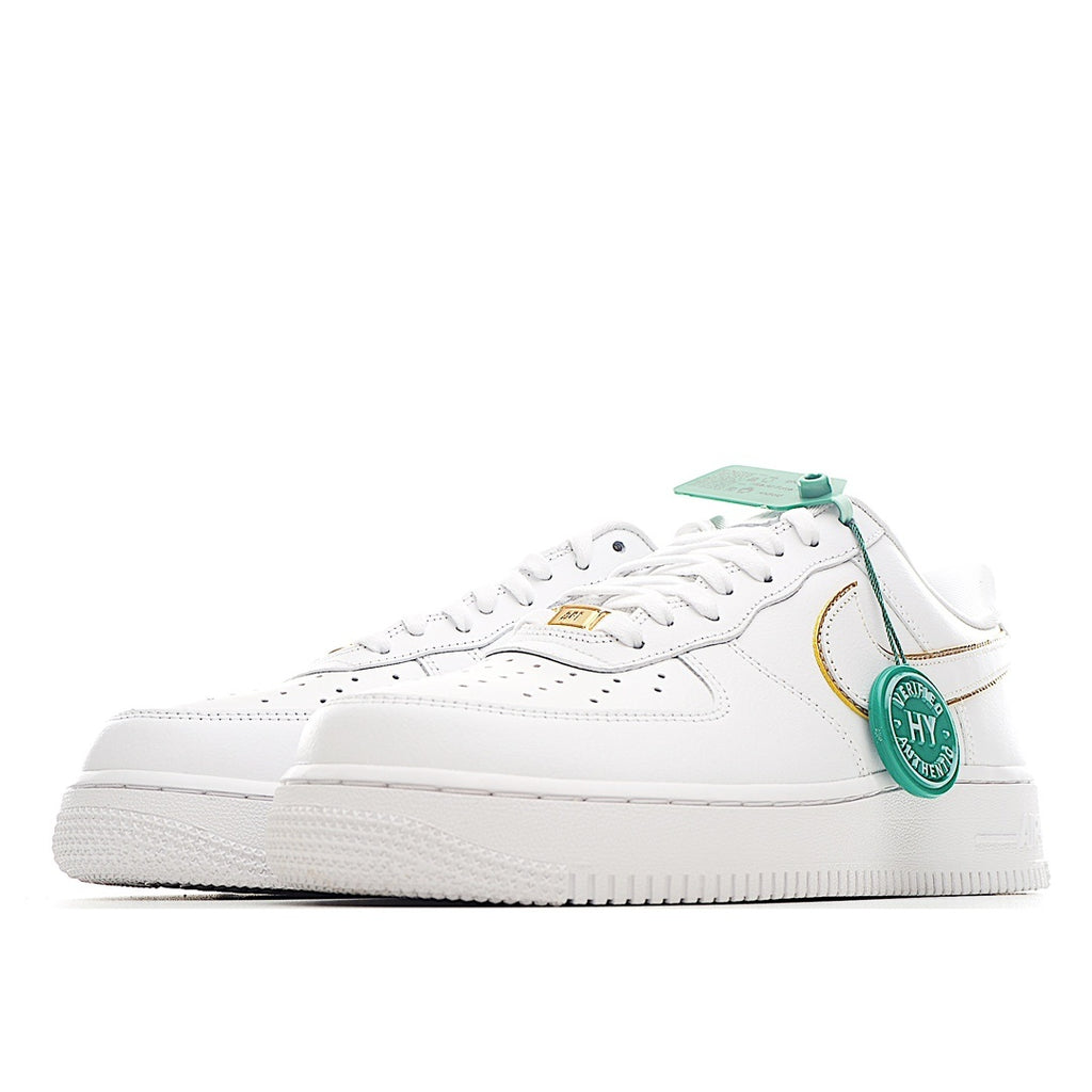 White Air Force 1 sneaker with green lace tag and gold-trim swoosh, side view.