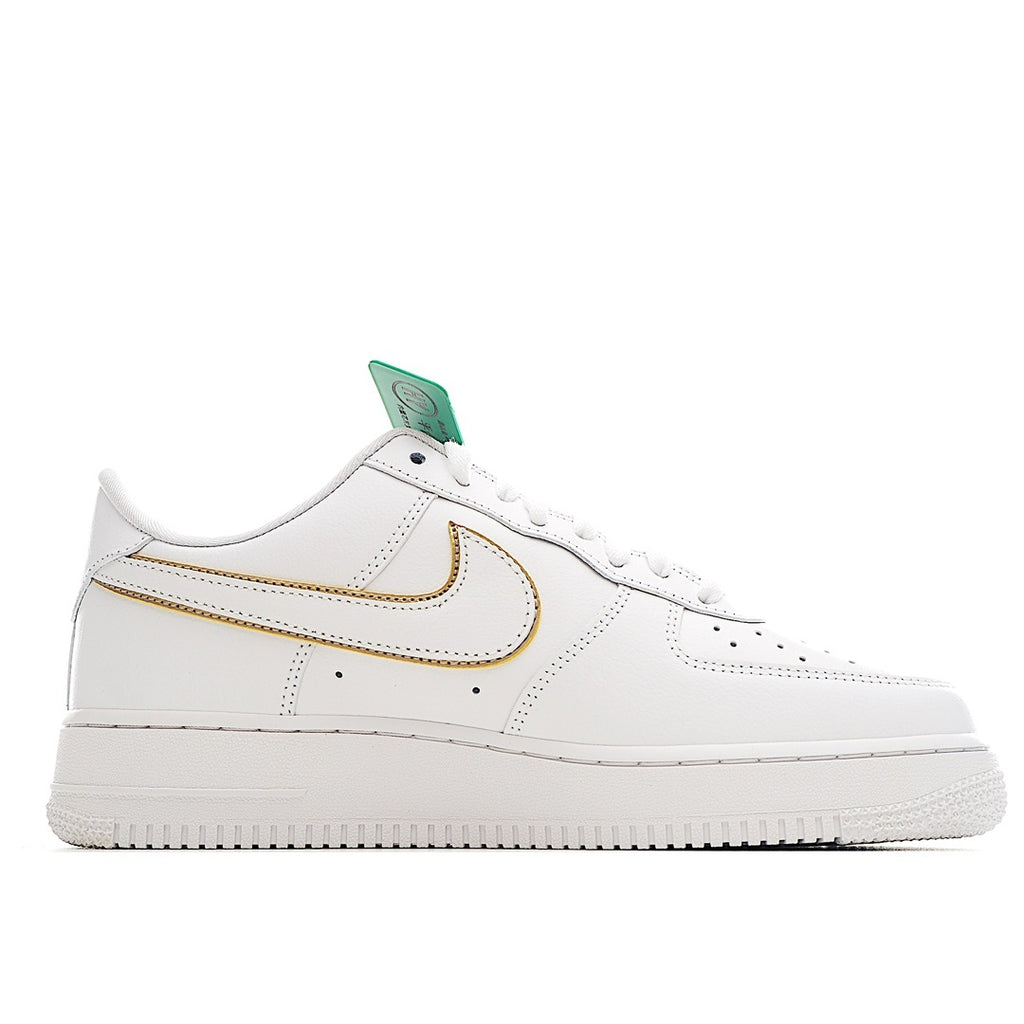 White Air Force 1 sneaker with gold-outlined swoosh and green lace tag, side profile.