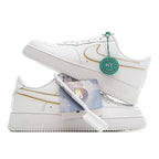 White Air Force 1 sneakers with gold-trim swoosh and green HY authenticity tag, angled view.