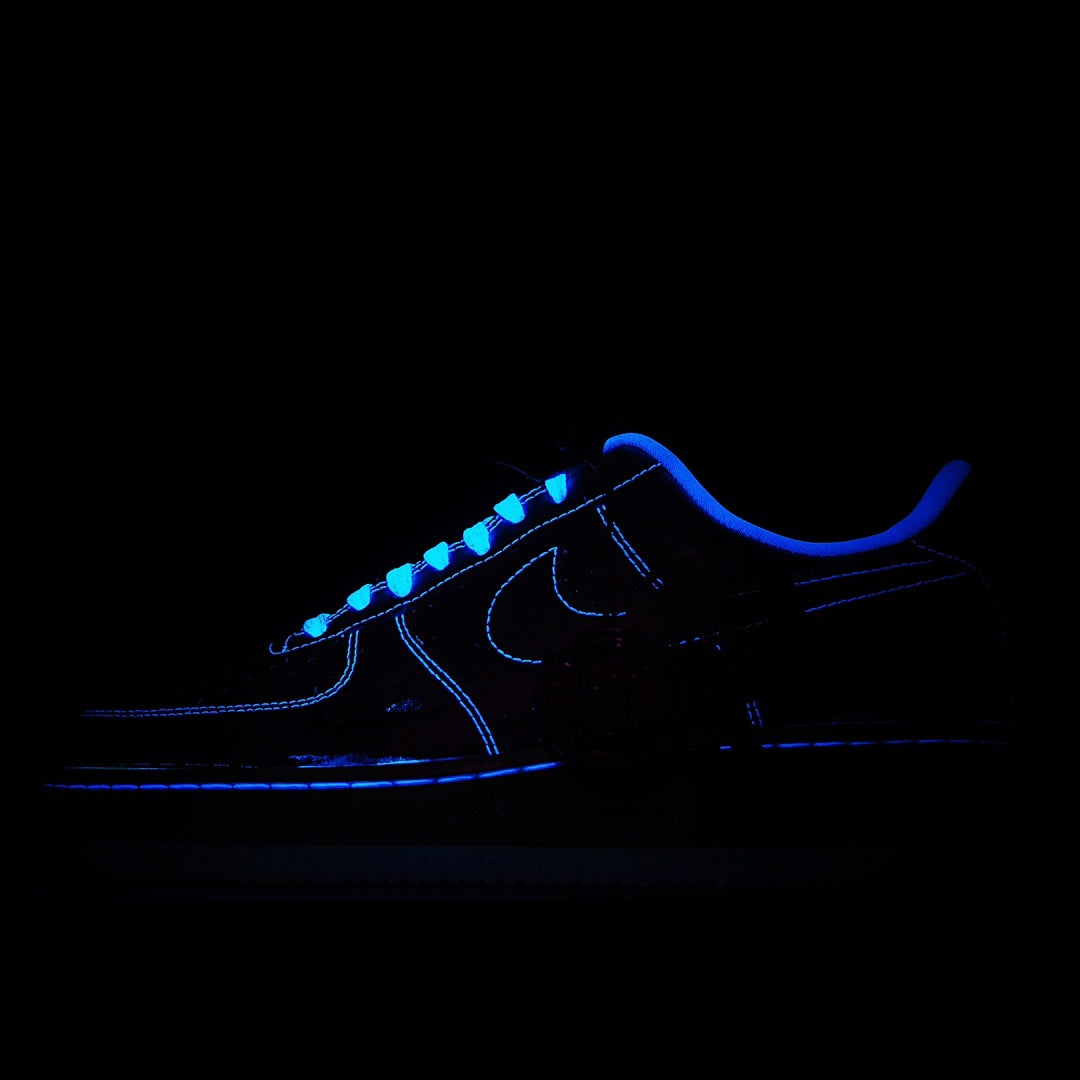 Dark Nike Air Force 1 sneakers with blue glowing laces and swoosh