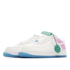 Low-top sneakers in white with pink heel panel and light-blue outsole; lace-up style