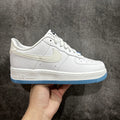 Nike Air Force 1 sneaker, white leather upper with blue outsole and swoosh