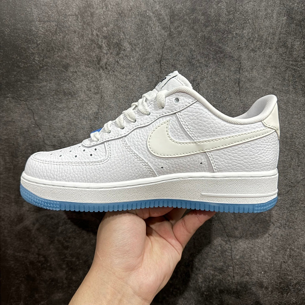 Nike Air Force 1 sneaker side view with white laces, swoosh, and blue sole
