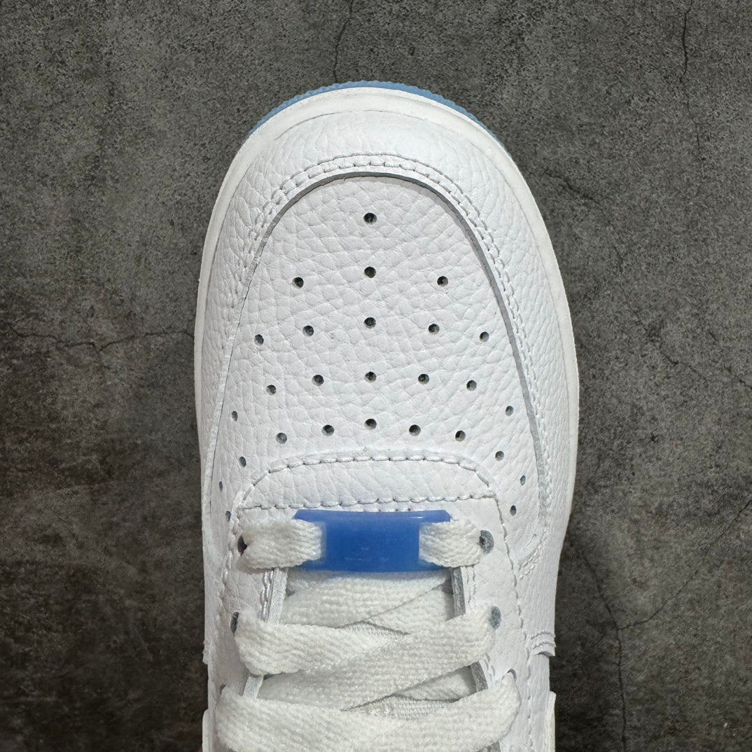 Nike Air Force 1 sneaker toe box close-up with perforations and white laces