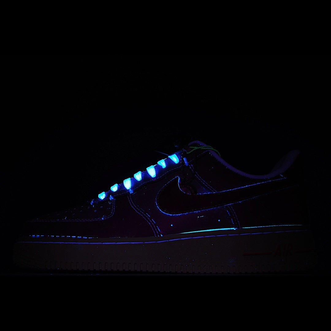 Dark Air Force 1-style sneakers with blue glowing trim and lace-up front