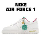 Nike Air Force 1 sneaker in white with pink lining and green tag