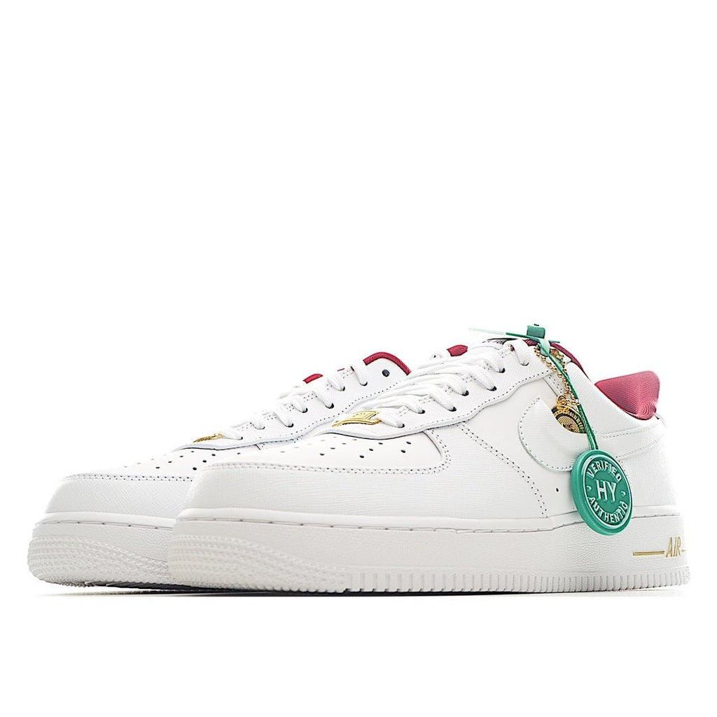 Nike Air Force 1 sneakers, white leather with pink collar and green authenticity tag
