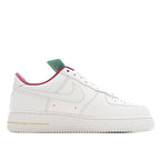 Nike Air Force 1 sneaker in white with pink collar and small gold accent