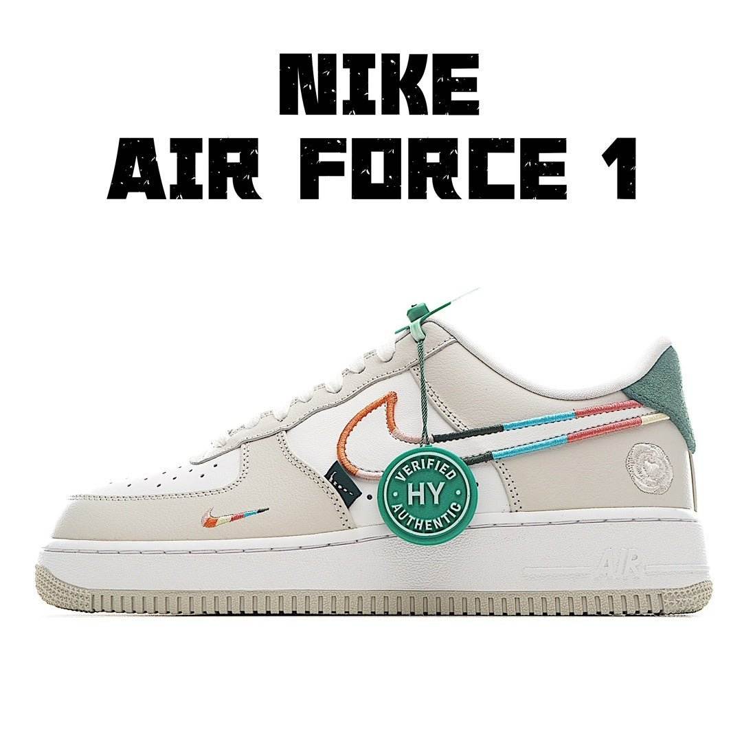 White low-top sneaker with green heel tab, orange swoosh, and multicolor side stripe