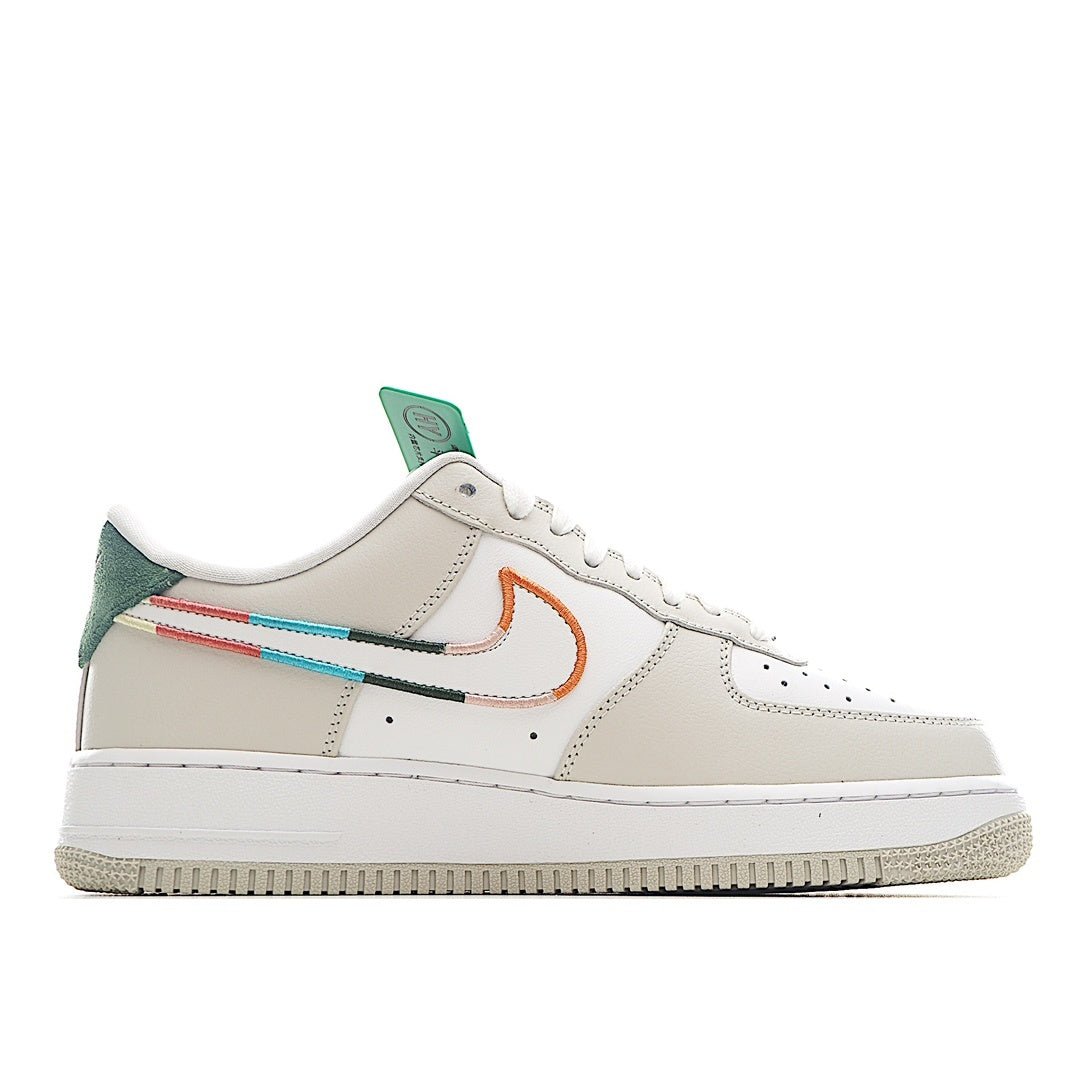 White Air Force 1 sneakers, side view with teal tongue and orange swoosh