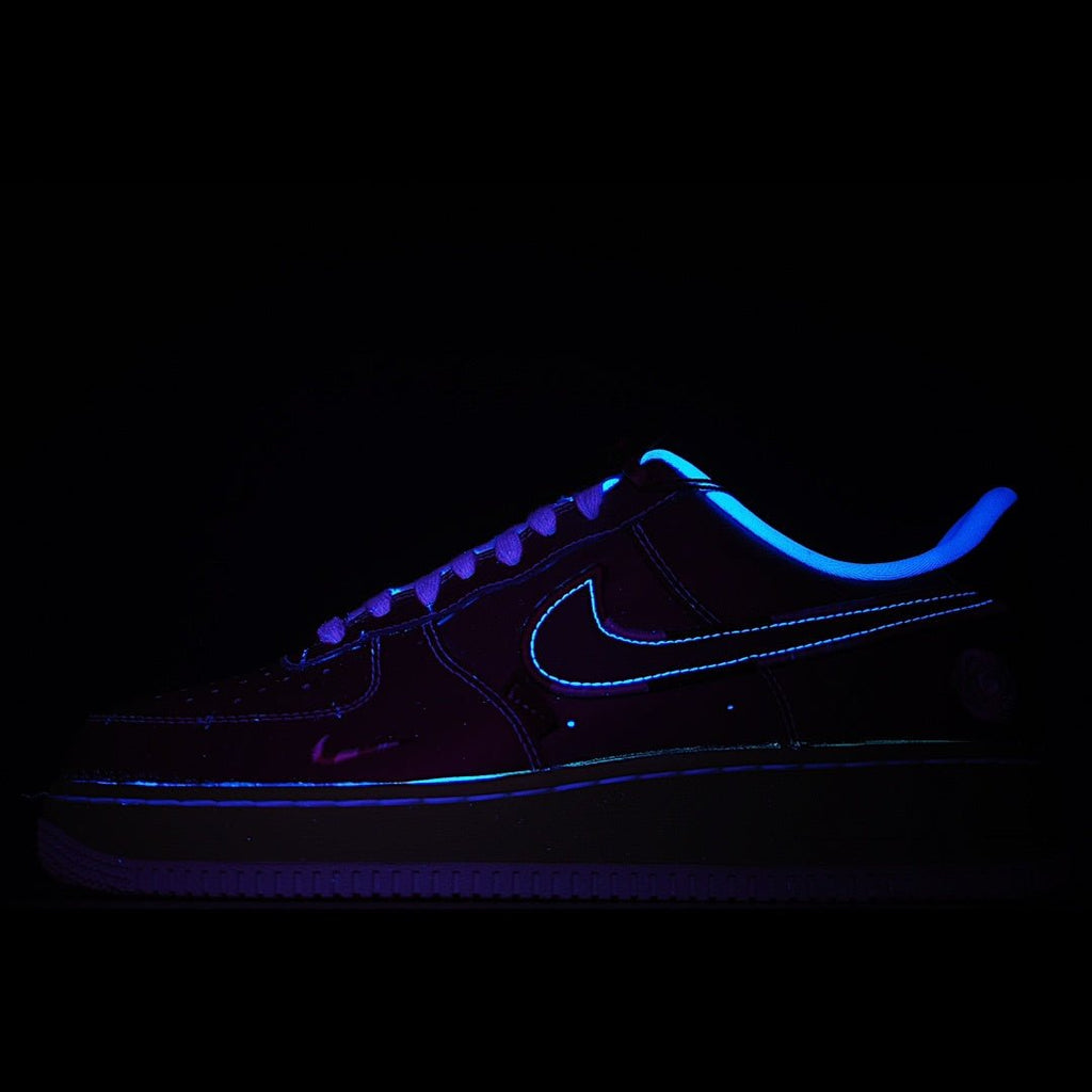 Dark Air Force 1 sneakers with blue swoosh and glowing blue accent stitching