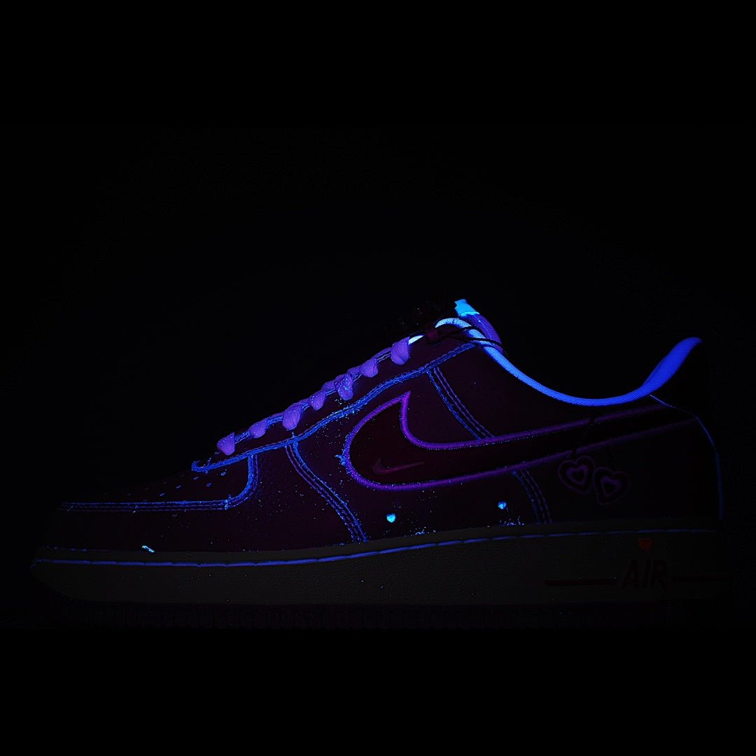 Dark blue low-top sneaker with neon-blue swoosh and lace-up