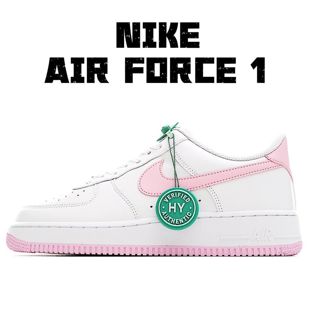 White Nike Air Force 1 sneakers with pink swoosh, green tag, and pink outsole