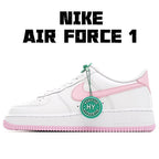 White Nike Air Force 1 sneakers with pink swoosh, green tag, and pink outsole