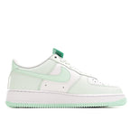 Low-top sneakers, white leather with mint green swoosh detail and perforated toe