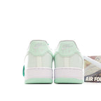 Low-top sneakers heel view, white leather with mint accents and Air branding tabs