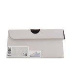 Shoe box, light gray/white with shipping label and product photo on sticker
