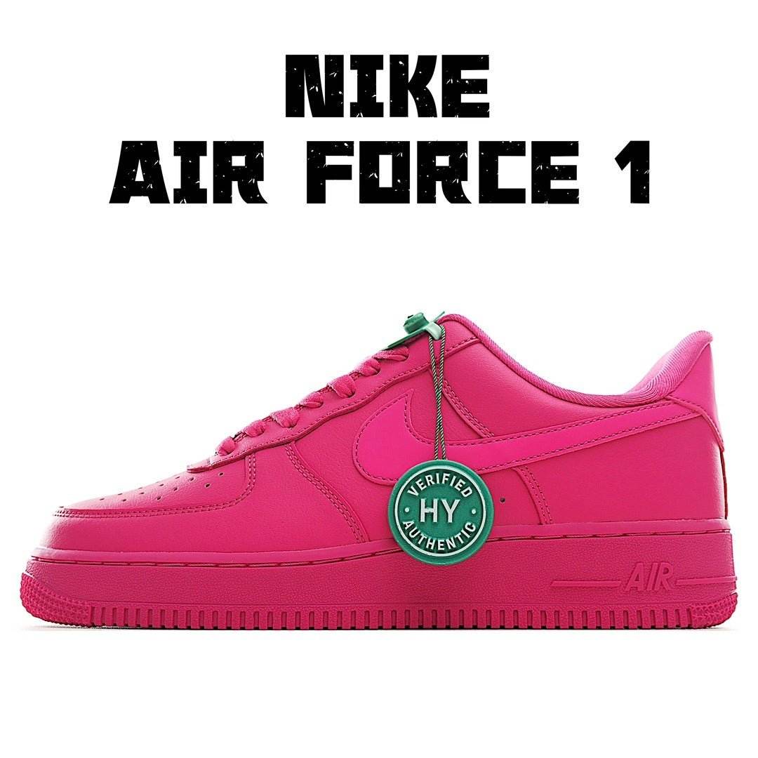 Pink low-top sneakers with Nike-style swoosh, green lace tag, cushioned sole