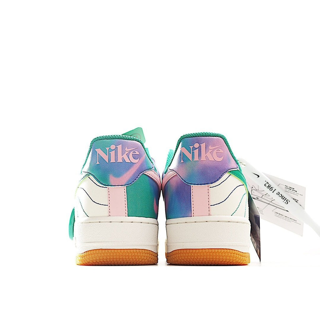 Pair of white low-top sneakers with teal and purple heel panels, lace-up, gum soles