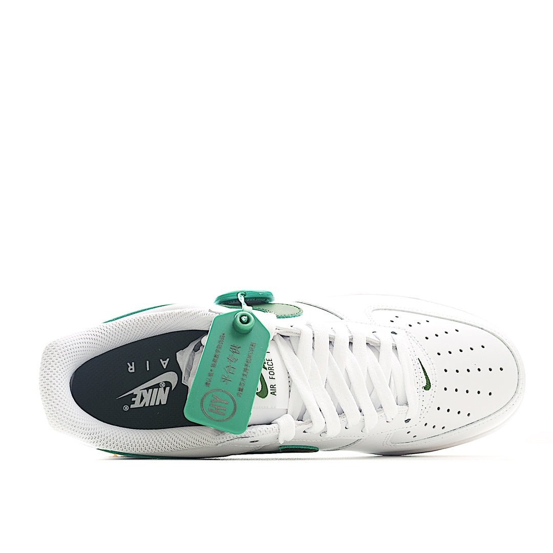 Nike Air Force 1 low-top sneakers, white with green lining and tan gum outsole tread