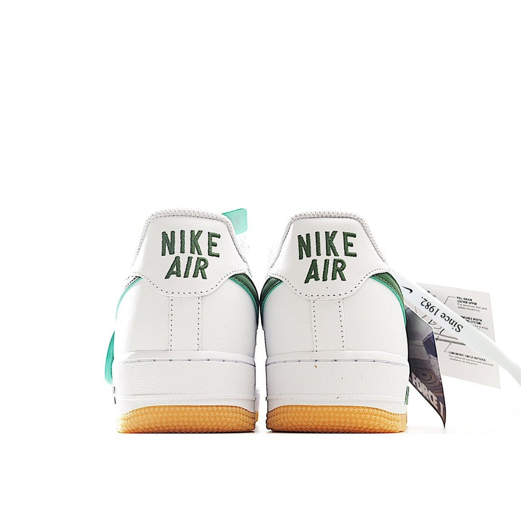 Nike Air Force 1 sneakers, white heel with green trim and tan gum sole