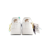 White Nike Air low-top sneakers with gold chain detail, back view