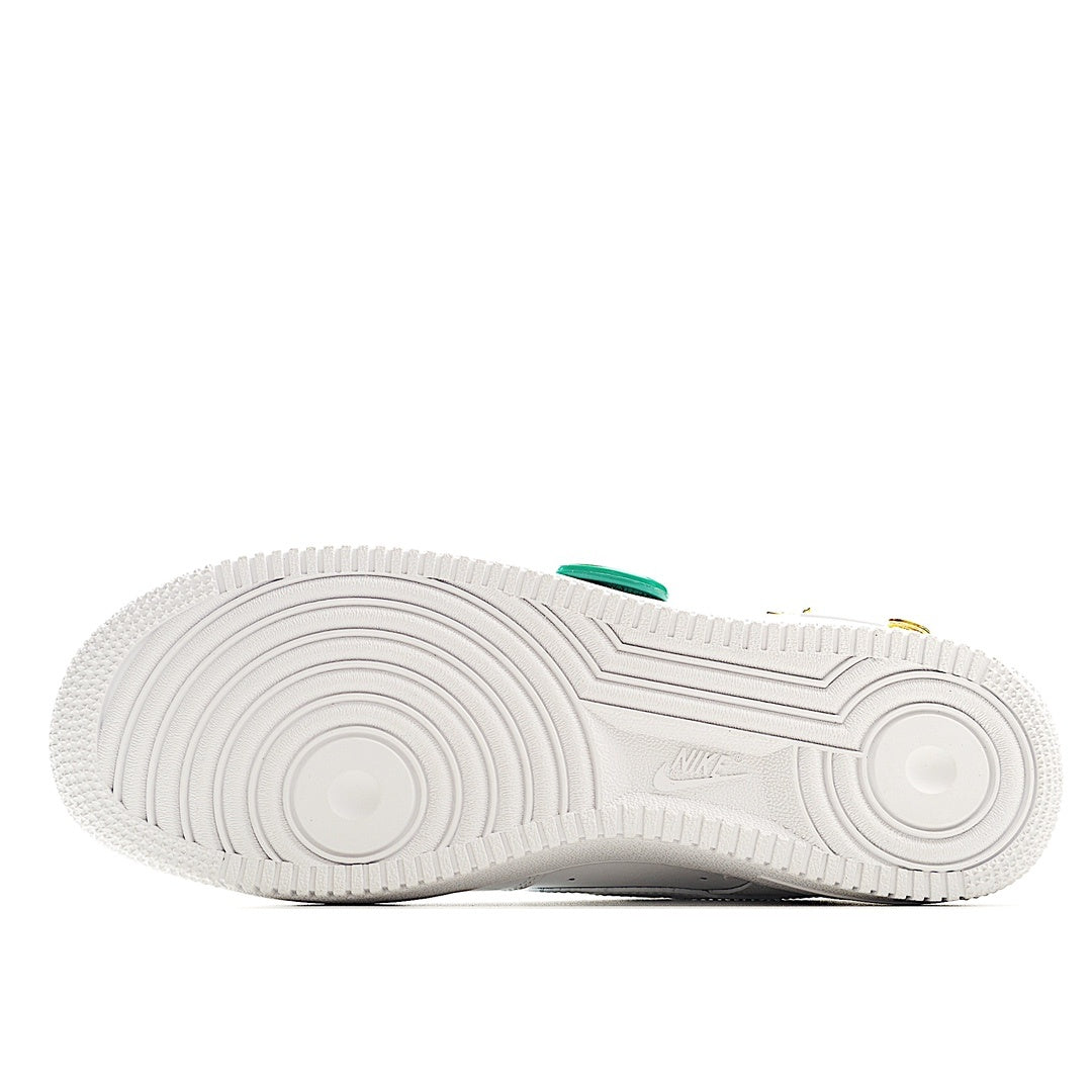 White sneaker outsole with green heel accent, bottom view