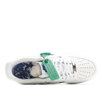 White low-top sneakers with blue patterned inner lining and insole